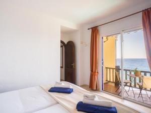 a bedroom with a bed and a view of the ocean at Altamar 60 Balcony beach views By CanariasGetaway in Playa del Aguila +80 photos