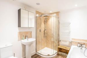 a bathroom with a shower and a sink at The Merchants House in Pittenweem +26 photos