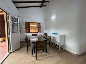 a dining room with a table and chairs at Villa Soussoute - à 2mn de la plage de Tartane in La Trinité