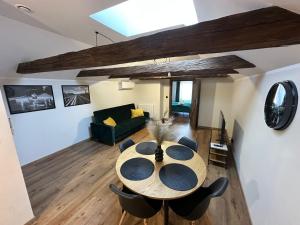a dining room with a table and some chairs at Kamienica LOFT in Ciechocinek