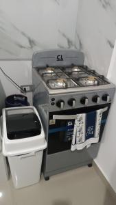 a stove sitting in a kitchen with at la casita de Daniela in San Miguel