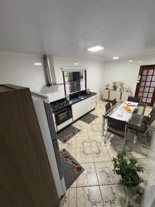 Μια τηλεόραση ή/και κέντρο ψυχαγωγίας στο Casa Luz do Sol - Joinville-SC