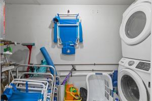 a laundry room with a washer and a washing machine at Golden Arms 101 in Chicken Island
