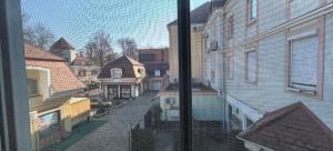 a view of a city street from a window at CentrumRoom in Hévíz