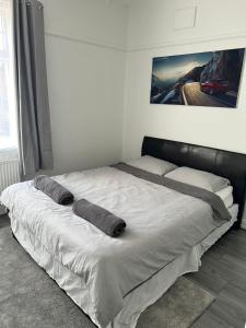 a bed in a room with two pillows on it at Tyne Relaxation in Newcastle upon Tyne