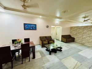 a living room with a couch and a table at Blue Vista Homestay in Guwahati