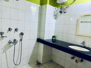 a bathroom with a shower and a sink at Blue Vista Homestay in Guwahati