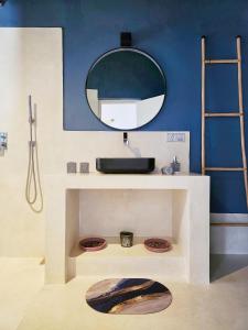 a bathroom with a sink and a mirror on a wall at Belika Beach in Hiriketiya +106 photos