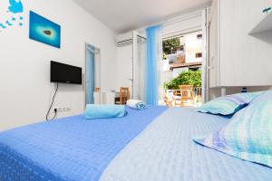 En eller flere senge i et værelse på Apartments Nona 1