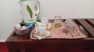 a table with a tray of food and a blender at Ella Sunrise Villa in Ella