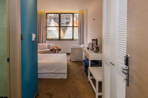Voodi või voodid majutusasutuse Hotel Passport toas