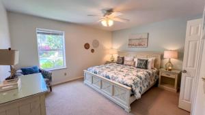 a bedroom with a bed and a window at Upscale & Spacious Home - Renovated - Pool in South Padre Island +139 photos