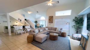 a living room with a couch and a table at Upscale & Spacious Home - Renovated - Pool in South Padre Island