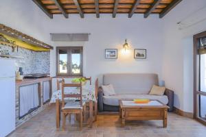 a living room with a couch and a table at Cartuja Rural in Barbate