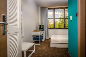TV a/nebo společenská místnost v ubytování Hotel Passport