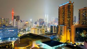 a view of a city skyline with tall buildings at Lucentia Suites Bukit Bintang Kuala Lumpur in Kuala Lumpur