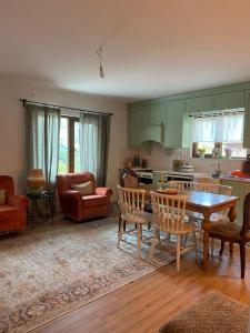 a kitchen and living room with a table and chairs at Altun's Home in Trabzon