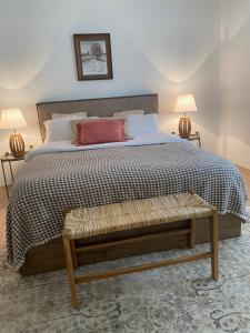 a bedroom with a large bed and two lamps at Altun's Home in Trabzon