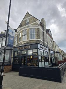a building on the corner of a street at Vacant Nests - The Ocean Retreat in South Shields