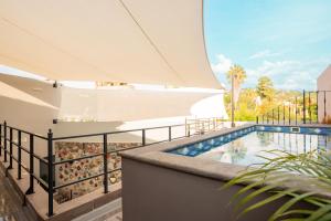 a balcony with a swimming pool on top of a building at Casa Studio San Miguel de Allende in San Miguel de Allende