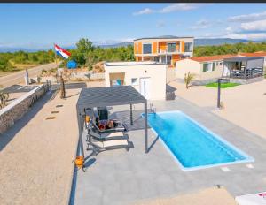 an image of a villa with a swimming pool at Auto-kamp Dvije suze 3 in Brištane