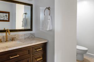 a bathroom with a sink and a mirror and a toilet at Hot Tubpoker Roomespresso3 Mi To Buffalo Trace in Frankfort +46 photos
