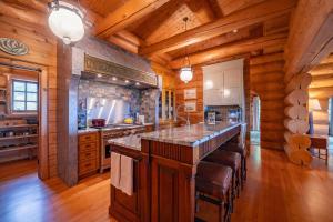 a large kitchen with wooden walls and wooden floors at Welcome to the Lodge! Little Falls NY in Little Falls