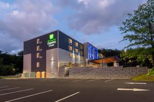 a building with a sign on the side of it at Holiday Inn Express & Suites Pittsfield-Lenox-Berkshires by IHG in Pittsfield +45 photos