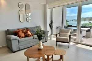 a living room with a couch and a table at Altamar in Nuevo Vallarta 