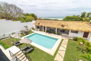 an aerial view of a villa with a swimming pool at CNonoru in Puerto Escondido
