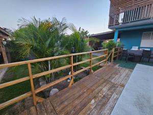 a wooden deck in front of a house at Pelican Dock Apartments in Aguada