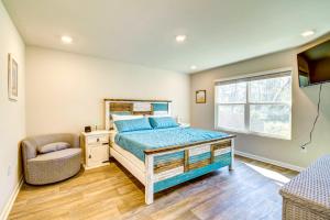 a bedroom with a bed and a chair and a window at Foley Vacation Rental 7 Mi to Gulf Shores Beaches in Foley