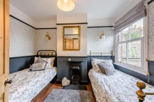 En eller flere senge i et værelse på Riverside Cottage - Rye