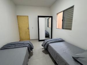 Postel nebo postele na pokoji v ubytování Casa em Cajamar - Polvilho, 10 minutos de Jordanésia