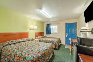 Μια τηλεόραση ή/και κέντρο ψυχαγωγίας στο Hotel O Longhorn Boise City OK
