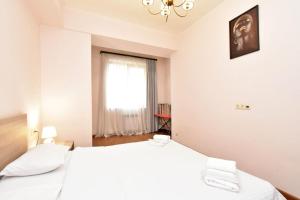 Postel nebo postele na pokoji v ubytování Apartments by MR Yeravan in the city centre