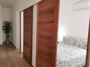 a sliding door in a room with a bed at Cozy suite with pool access in Punta Cana