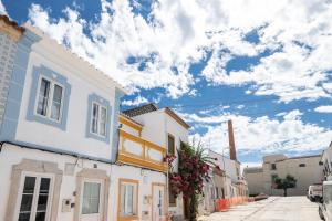 a street in a town with white houses at Casa das Letras by east ALgarve guest in Tavira