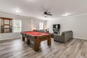 a living room with a pool table and a couch at 11 Mi to Fort Lee 30-Acre Retreat with Scenic Views in Pickadat Corner