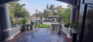 a view of a porch with potted plants at Villa Solace in Ban Pho Touane +5 photos