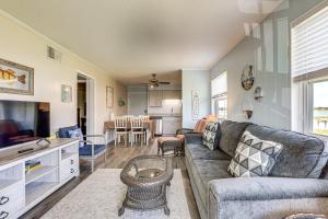 a living room with a couch and a table at Private Beach & Pool Access: Murrells Inlet Condo! in Myrtle Beach