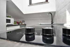 a kitchen with a sink and a counter top at Apartment Mario in Martina