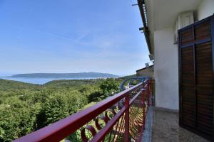 a balcony with a view of the ocean at Apartment Mario in Martina