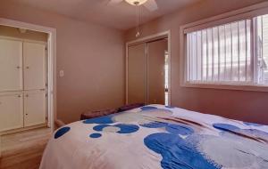 a bedroom with a bed and a window at One Bedroom Condo with Bay and Ocean Views San Die in San Diego +3 photos