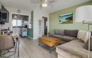 a living room with a couch and a table at One Bedroom Condo with Bay and Ocean Views San Die in San Diego