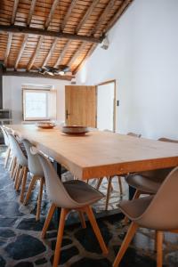 a large wooden table and chairs in a room at Serra Casa in Marvão