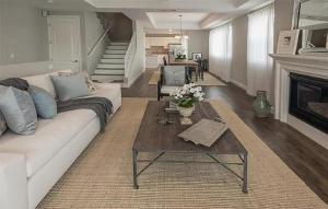 a living room with a white couch and a coffee table at Four Bedroom Condo in North Hollywood in La Paco