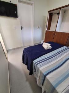 Giường trong phòng chung tại Pousada Vila Praiana