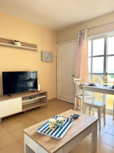 TV a/nebo společenská místnost v ubytování El amanecer