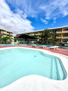 Bazén v ubytování El amanecer nebo v jeho okolí